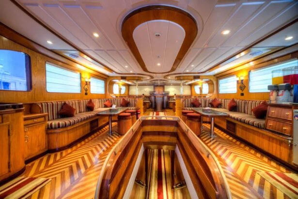 Lounge and dining saloon with striped seating aboard the Golden Dolphin I liveaboard
