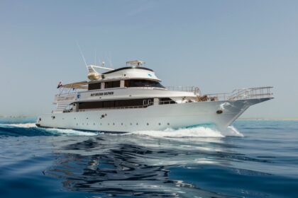 MV Golden Dolphin liveaboard dive boat underway leaving a wake at sea
