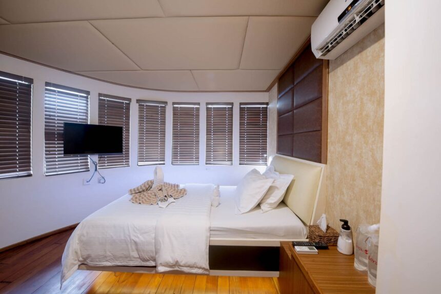 Cabin bed with towel decorations aboard the Adora liveaboard