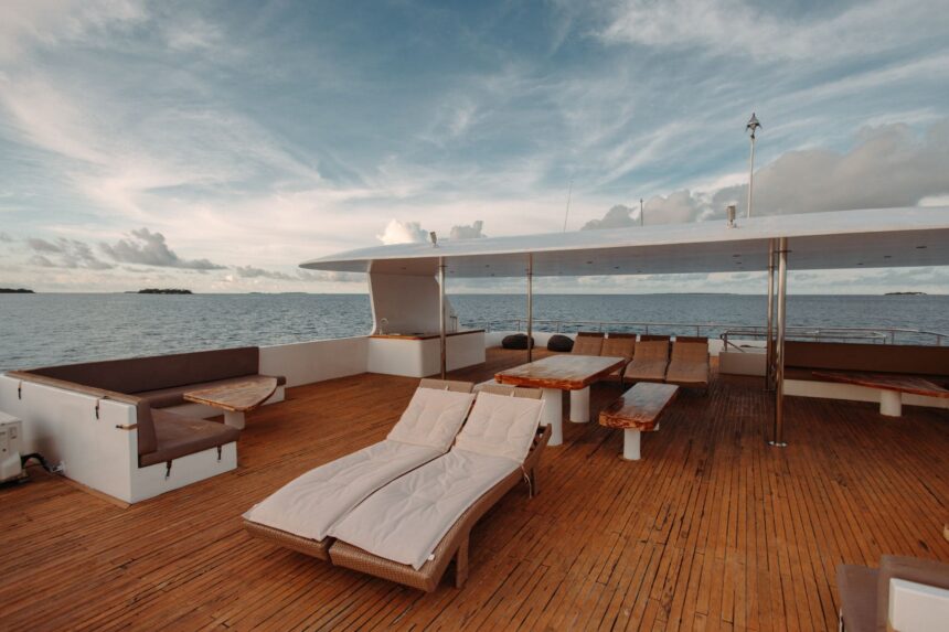Sun deck loungers and seating area aboard the Adora liveaboard