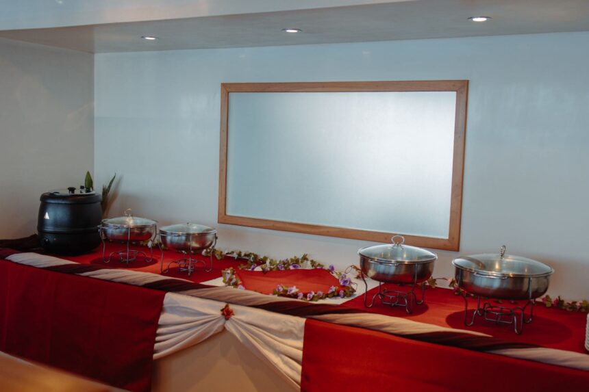 Buffet spread of covered dishes set out on the Adora