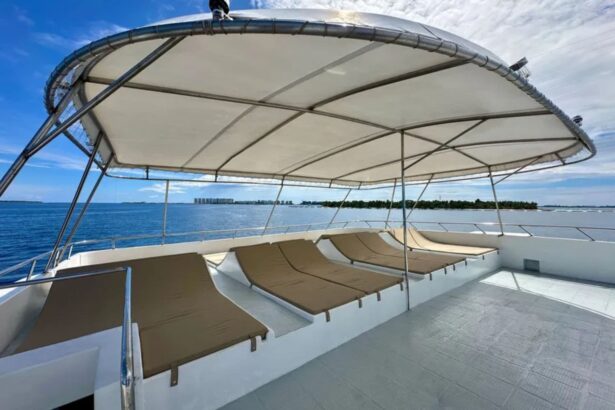 Covered lounge deck with sun loungers aboard the Amba