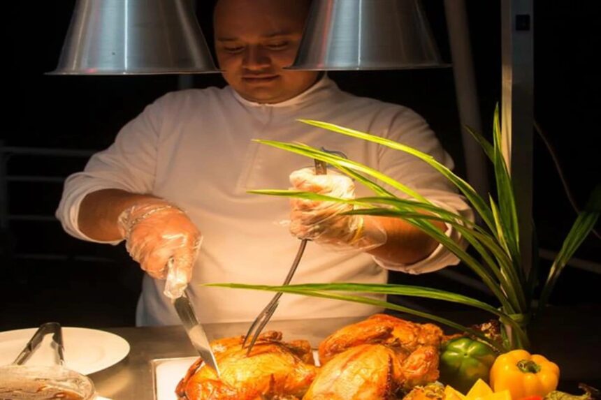 chef carving roasted meats at an onboard buffet on Discovery Palawan