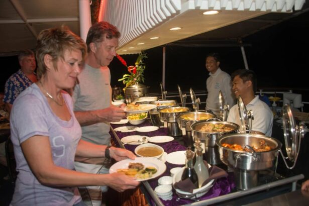 guests serving themselves at a buffet dinner aboard Discovery Palawan