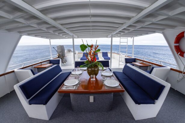 outdoor dining table set on Atlantis Adventurer's sundeck