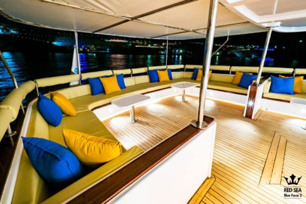 Sun deck lounge seating lit up at night aboard the Red Sea Blue Force 2