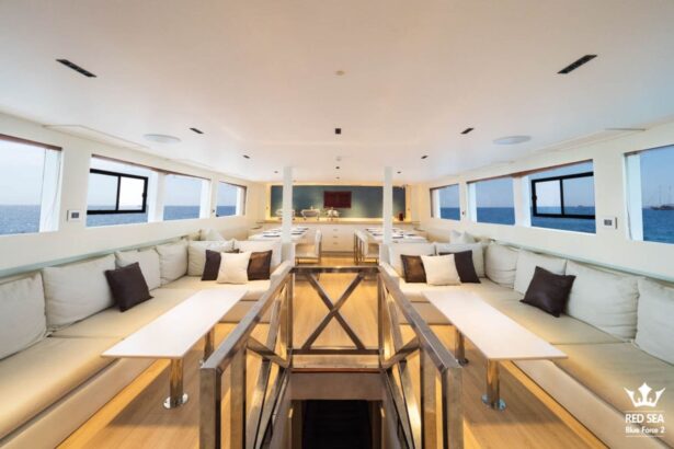 long salon lounge with cushioned bench seating aboard Red Sea Blue Force 2