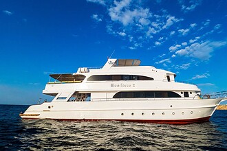 Blue Force 2 liveaboard dive boat cruising the Red Sea under clear skies