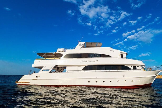 Blue Force 2 liveaboard dive boat cruising the Red Sea under clear skies