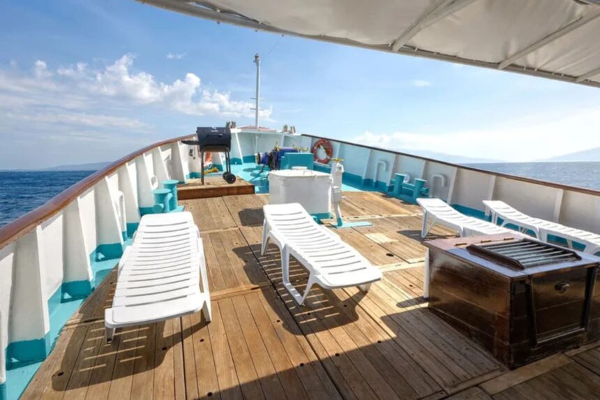 Sun loungers on the open deck of the M/Y Resolute overlooking the ocean