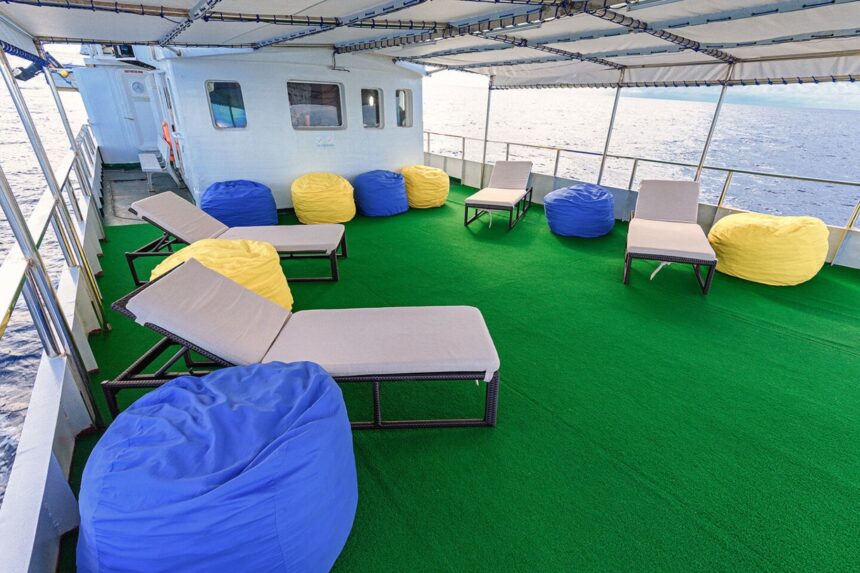 Astroturf deck lounge with colorful beanbags aboard the M/Y Resolute