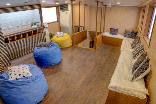 A lounge cabin with beanbag seating and wood flooring aboard the M/Y Resolute