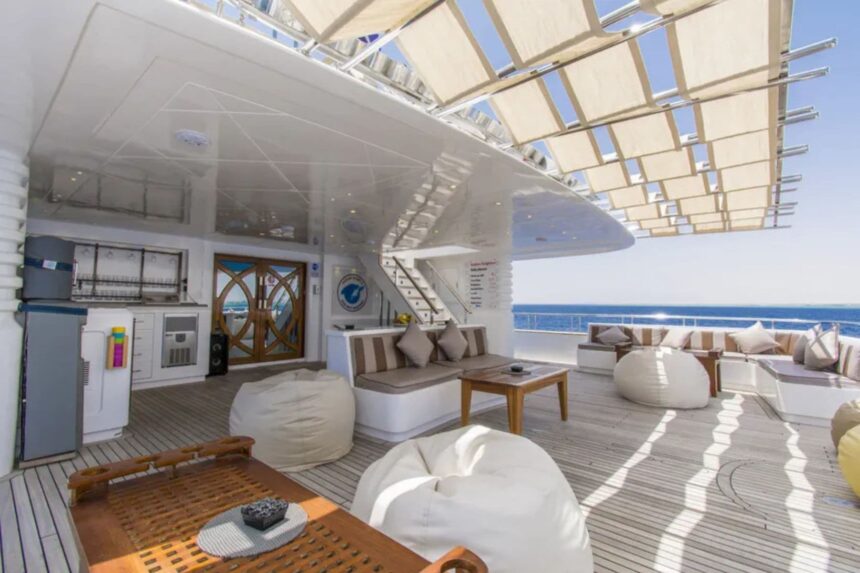 Shaded outdoor lounge with beanbags and sofas aboard the Golden Dolphin IV