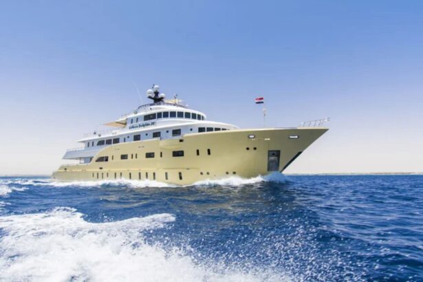 Golden Dolphin IV liveaboard cruising at speed leaving a white wake