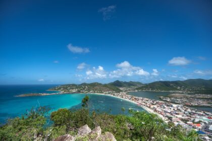 Aerial view of St. Maarten's turquoise lagoon bay and hillside town