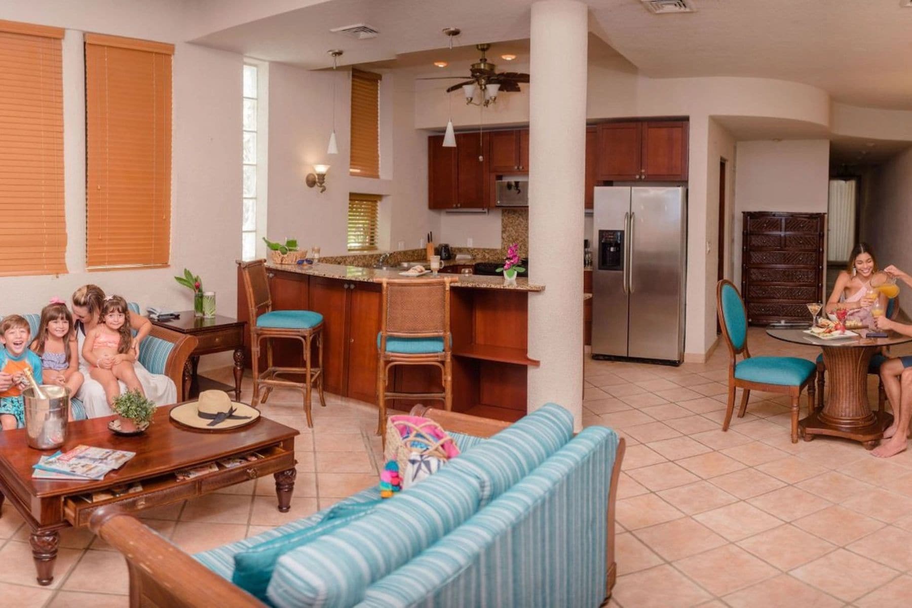 Family suite living area at Mayan Princess Dive & Beach Resort with kitchen and dining nook