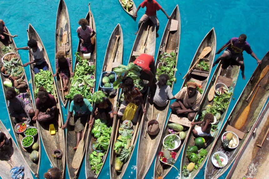 Diving The Solomon Islands Floating Market Local villagers come to sell fresh produce to the MV Bilikiki. (Photo by Kellie Oldfield)