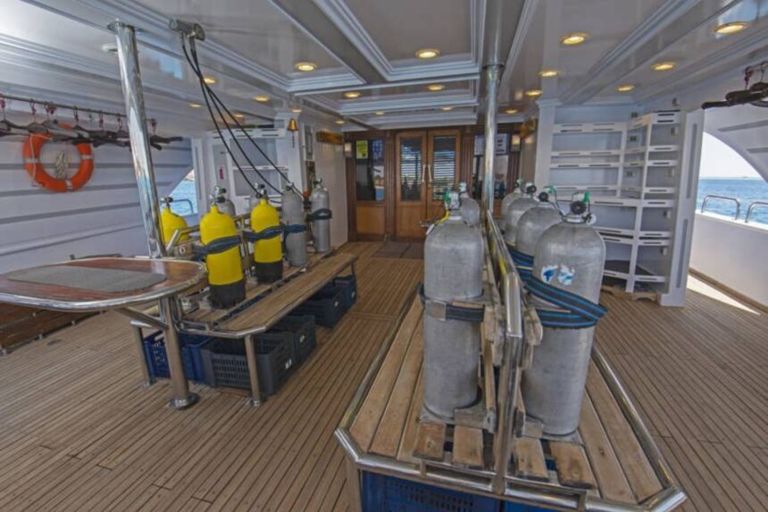 Nitrox and air tanks racked on the dive deck of the Golden Dolphin II liveaboard
