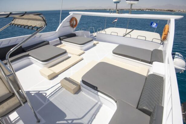 Sun loungers and cushioned seating on the top deck of the Golden Dolphin II