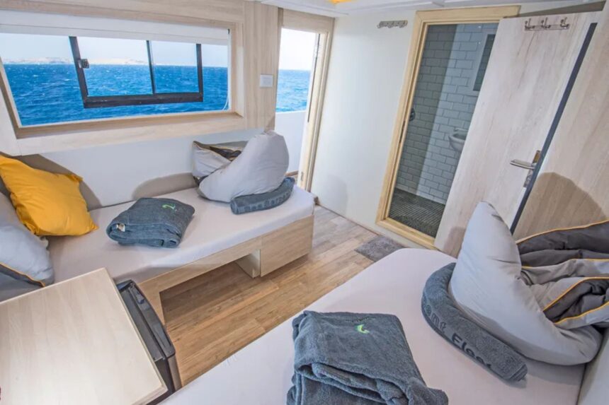 Cabin seating area with a bean bag chair and en-suite bathroom aboard the SS Glorious Miss Nouran