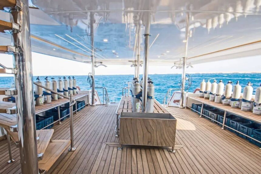 Dive tanks racked on the dive deck of the SS Glorious Miss Nouran liveaboard