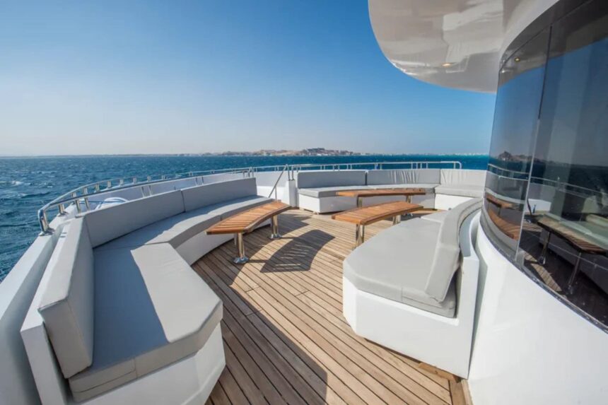Curved white lounge seating on the aft deck of the SS Glorious Miss Nouran