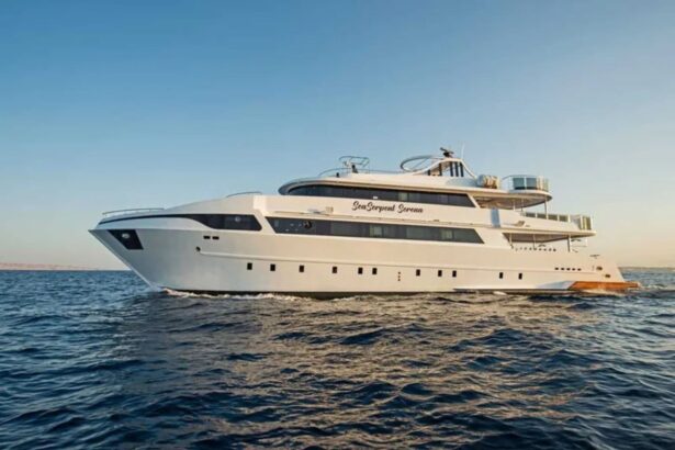 SS Serena Dreams liveaboard yacht cruising calm water under a clear sky, side view