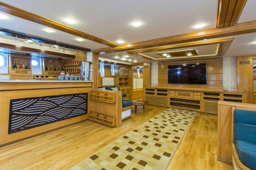 mirrored dining room aboard the Golden Dolphin III with sailboat artwork