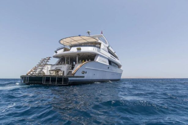 the Golden Dolphin III liveaboard cruising at sea, viewed from the stern