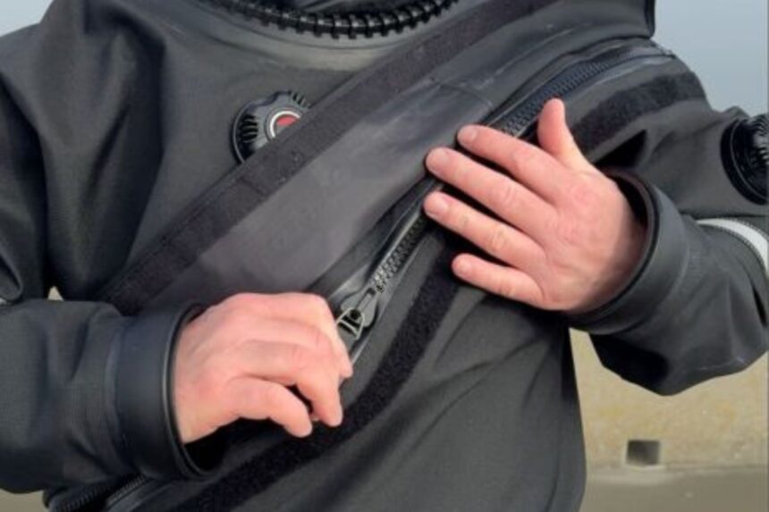 Zipper Flap On The Hollis DX-300X Close-up of the Hollis DX-300X chest zipper with the hook and loop protective flap folded back