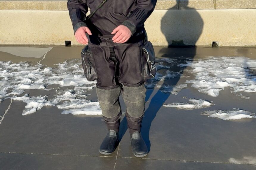 Northern Diver HID Thigh Pockets Thigh cargo pockets on the Northern Diver HID drysuit as our tester stands on icy concrete