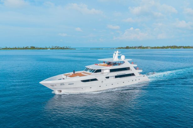 Maldives Master liveaboard yacht cruising past palm-lined islands