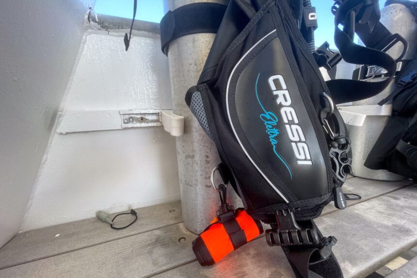 D-rings on the lower panel of the Cressi Elettra BCD rigged to a cylinder on a dive boat