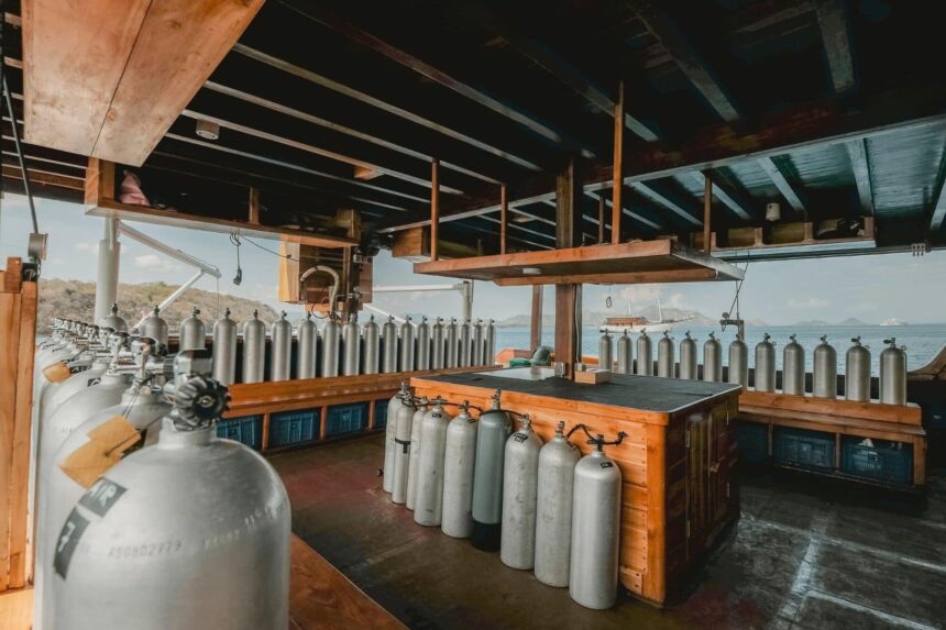 rows of scuba tanks staged on the dive deck of the Indo Master liveaboard