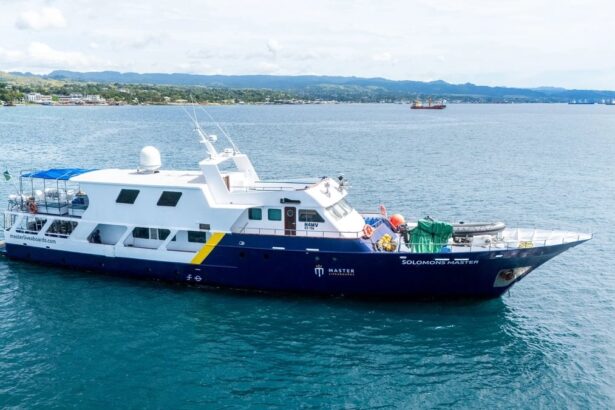 Side view of the Solomons Master liveaboard yacht moored offshore