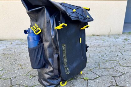 Cressi Venom dry backpack seen from the side, showing the two front pockets and bottle holder
