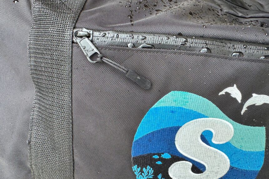 Water Beading on the Duffel Water beading on the zipper and fabric beside the Scuba.com logo on the duffel