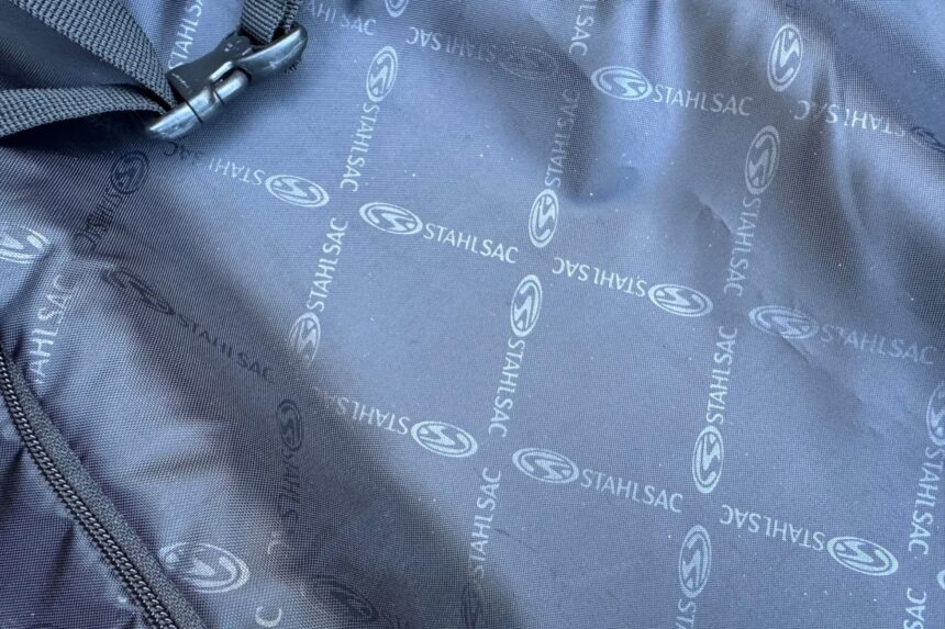 Stahlsac branded lining fabric inside the Curacao Clipper main section with a strap clip