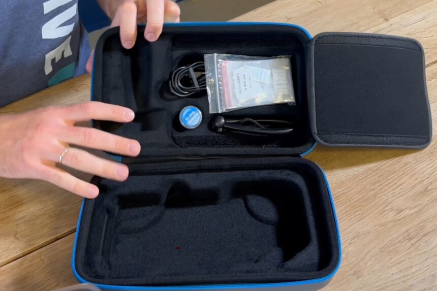 Oceanic Plus Housing Case Contents Our tester opening the Oceanic+ housing carry case, showing the cable, tools and spare parts in foam