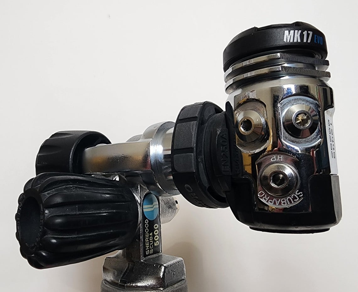 ScubaPro MK17 EVO first stage mounted on a cylinder valve with its DIN fitting and yoke converter