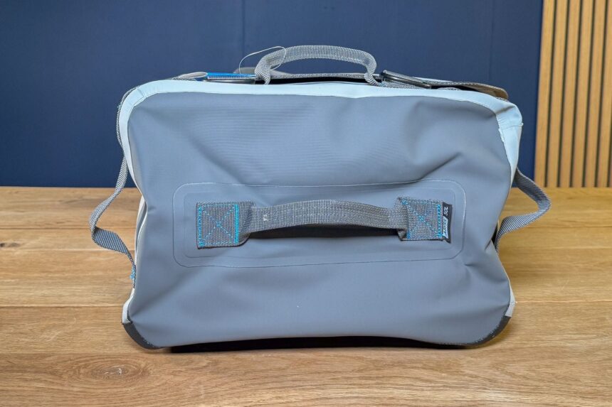 Back panel of the grey Stahlsac Abyss duffel showing the webbing grab handle
