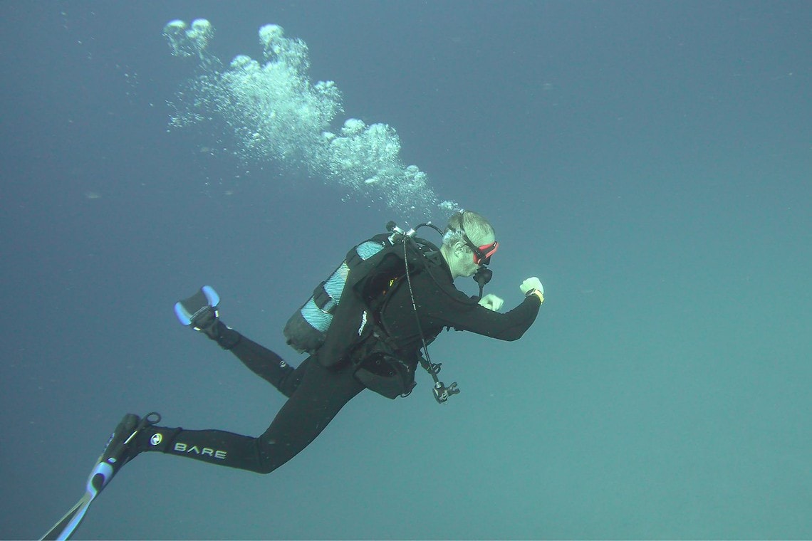 Torben swimming in side profile during a Zeagle Fury test dive at 90 feet in Malta