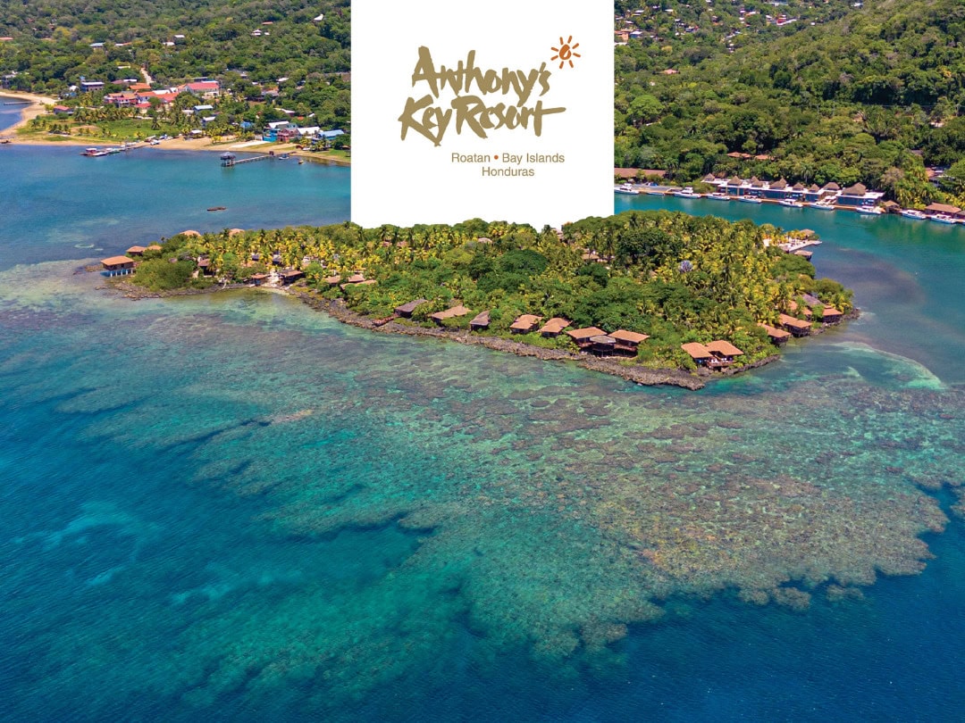 Aerial view of Anthony's Key Resort's private island in Roatan surrounded by coral reef
