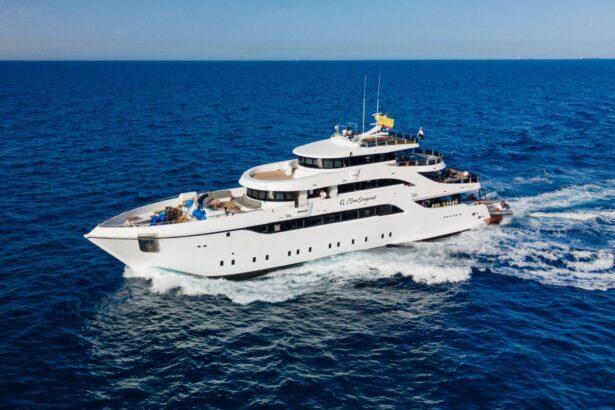 The Glory Sea Explorer liveaboard cruising open water with its bow wake fanning out