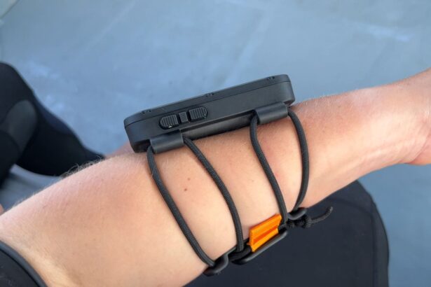 Side view of the Suunto Nautic and its bungee strap on our tester's forearm