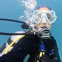 Our tester breathing from the Mares Planet 88X in warm Maldivian water