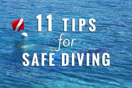Dive flag buoy floating on blue water with text reading 11 Tips For Safe Diving