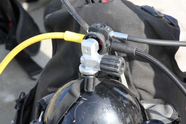 Zeagle F8 first stage clamped to a tank valve during testing, with the yellow octo hose routed forward