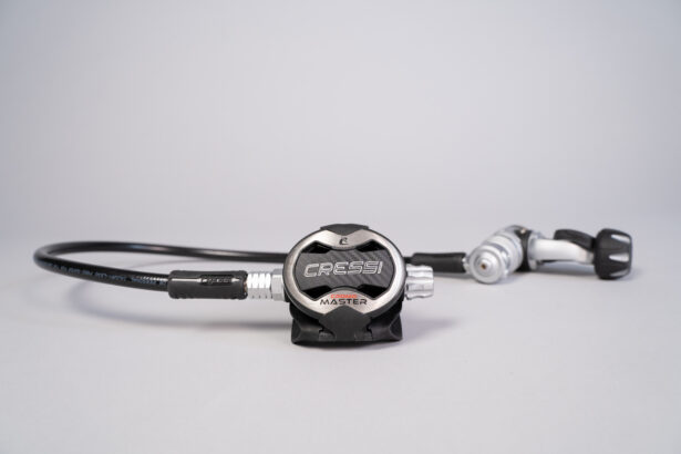 Cressi AC25 Master Cromo regulator set with second stage, hose and first stage on a plain background