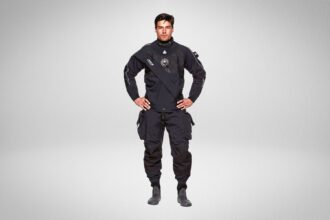 Man wearing the Waterproof D9X Breathable drysuit, front view with thigh pockets and neck seal